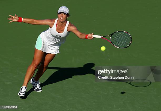 Vavara Lepchenko reaches for a serve from Nadia Petrova of Russia during day seven of the Mercury Insurance Open Presented By Tri-City Medical at La...