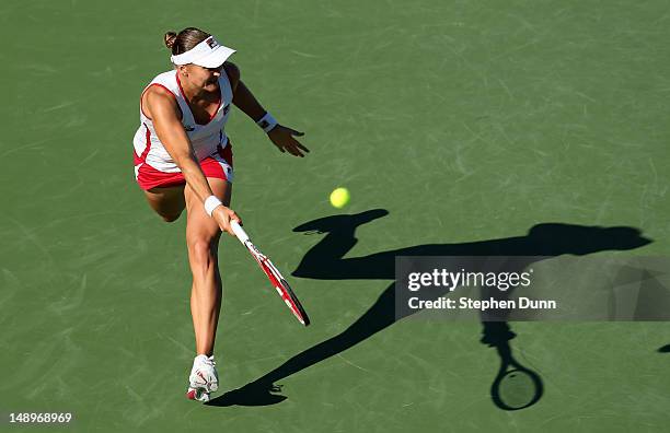 Nadia Petrova of Russia hits a shot to Vavara Lepchenko during day seven of the Mercury Insurance Open Presented By Tri-City Medical at La Costa...