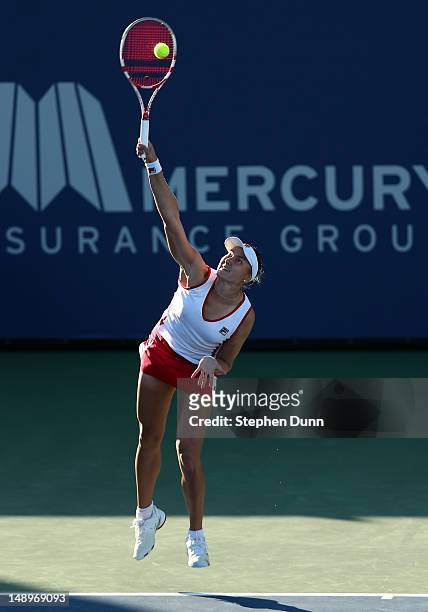 Nadia Petrova of Russia serves to Vavara Lepchenko during day seven of the Mercury Insurance Open Presented By Tri-City Medical at La Costa Resort &...