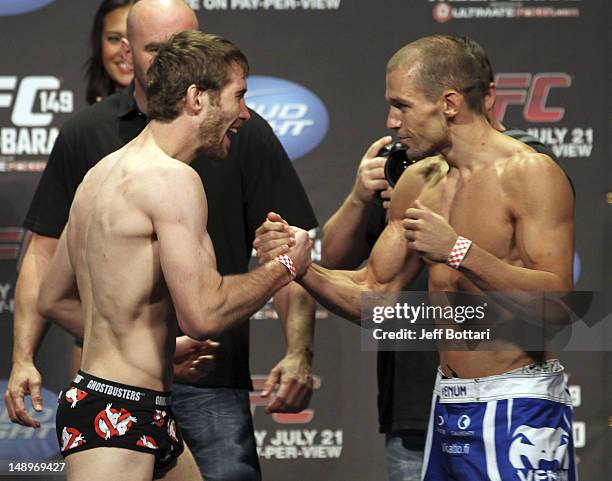 Mitch Clarke and Anton Kuivanen face off at the UFC 149 weigh-in at the Scotiabank Saddledome on July 20, 2012 in Calgary, Alberta, Canada.