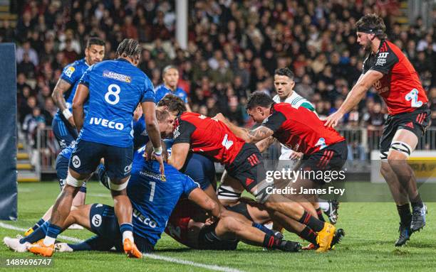 Tom Christie of the Crusaders attempts to force the ball over the line during the round 12 Super Rugby Pacific match between Crusaders and Blues at...