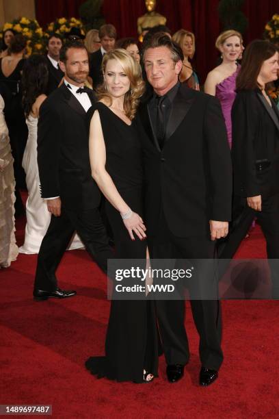 Robin Wright Penn and Sean Penn attend the 81st annual Academy Awards at the Kodak Theatre. Wright Penn wears Monique Lhuiller and Penn wears Giorgio...