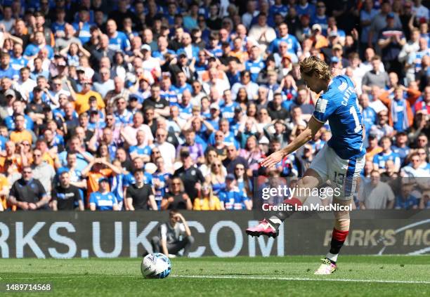 Todd Cantwell of Rangers FC scores the team's first goal during the Cinch Premiership match between Rangers and Celtic at Ibrox Stadium on May 13,...