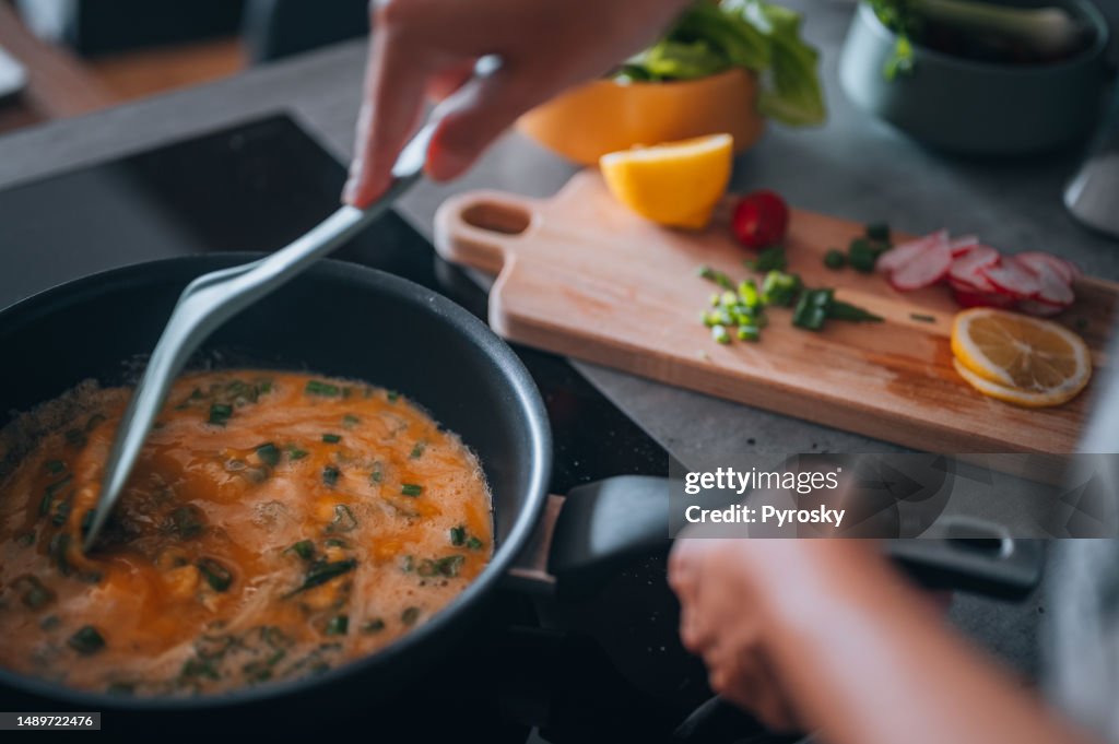 Preparing tasty scrambled eggs