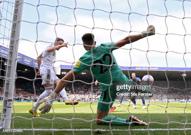 Luke Ayling of Leeds United scores the team's first goal past Nick Pope of Newcastle United during the Premier League match between Leeds United and...