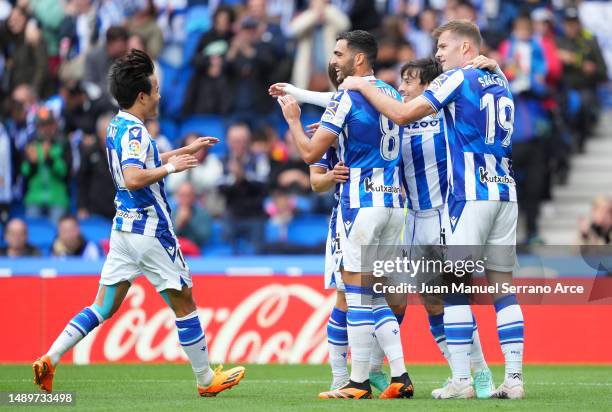 David Silva of Real Sociedad celebrates with teammates after scoring the team's second goal during the LaLiga Santander match between Real Sociedad...