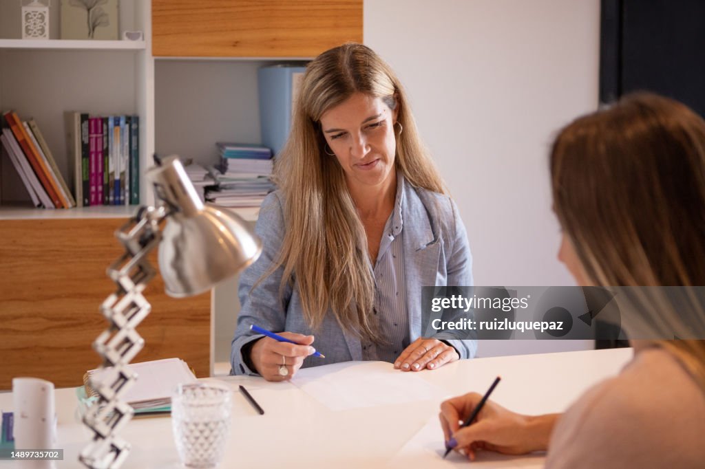 Patient and psychologist at drawing personality test