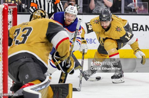 Connor McDavid of the Edmonton Oilers takes a shot against Adin Hill of the Vegas Golden Knights as Nicolas Hague of the Golden Knights defends in...