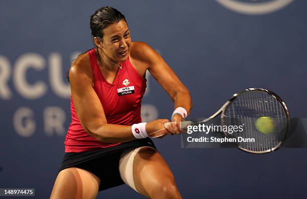 Marion Bartoli of France returns a shot to Christina McHale during day seven of the Mercury Insurance Open Presented By Tri-City Medical at La Costa...