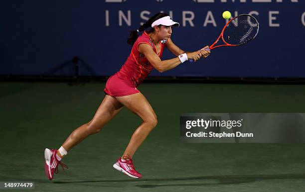 Christina McHale returns a shot to Marion Bartoli of France during day seven of the Mercury Insurance Open Presented By Tri-City Medical at La Costa...