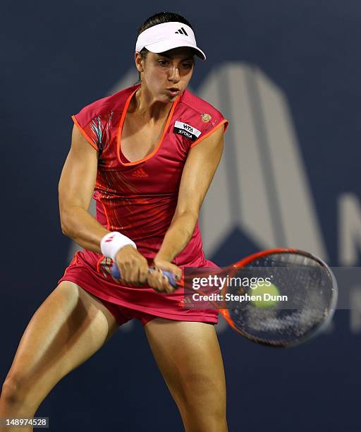 Christina McHale returns a shot to Marion Bartoli of France during day seven of the Mercury Insurance Open Presented By Tri-City Medical at La Costa...