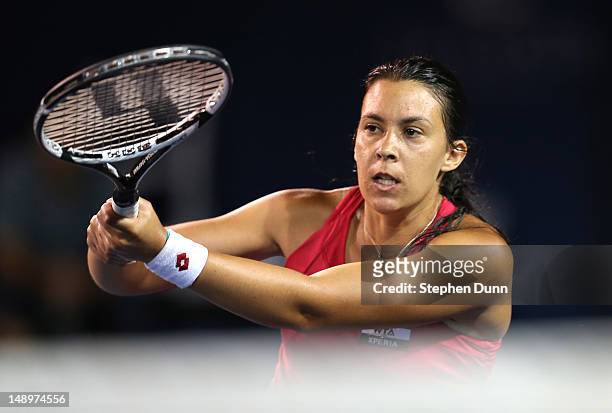 Marion Bartoli of France plays at thenet against Christina McHale during day seven of the Mercury Insurance Open Presented By Tri-City Medical at La...