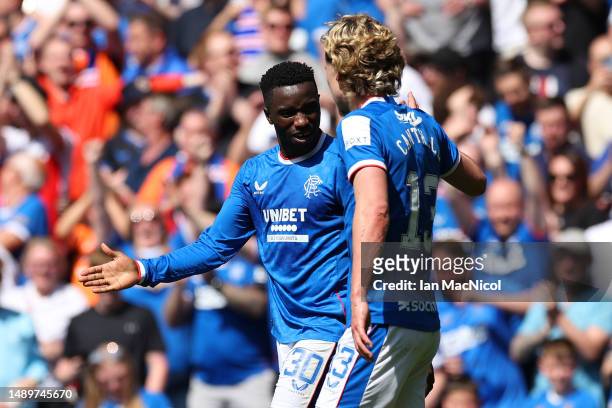 Fashion Sakala of Rangers FC celebrates after scoring the team's third goal during the Cinch Premiership match between Rangers and Celtic at Ibrox...