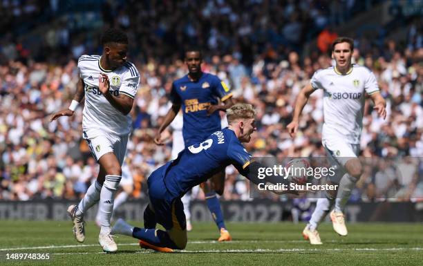 Anthony Gordon of Newcastle United is fouled by Junior Firpo of Leeds United during the Premier League match between Leeds United and Newcastle...