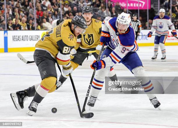 Connor McDavid of the Edmonton Oilers skates with the puck against Jonathan Marchessault of the Vegas Golden Knights in the third period of Game Five...