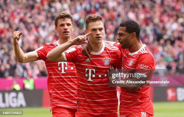 Joshua Kimmich of FC Bayern Munich celebrates with teammates after scoring the team's second goal during the Bundesliga match between FC Bayern...