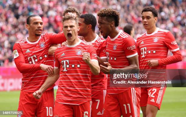 Joshua Kimmich of FC Bayern Munich celebrates with teammates after scoring the team's second goal during the Bundesliga match between FC Bayern...