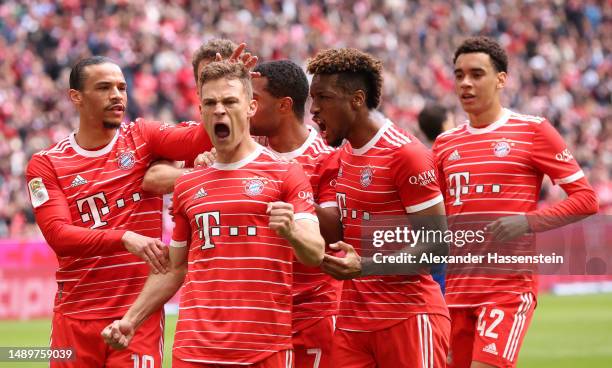 Joshua Kimmich of FC Bayern Munich celebrates with teammates after scoring the team's second goal during the Bundesliga match between FC Bayern...