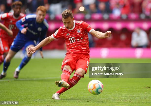 Joshua Kimmich of FC Bayern Munich scores the team's second goal during the Bundesliga match between FC Bayern München and FC Schalke 04 at Allianz...