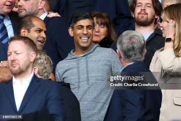 Rishi Sunak, Prime Minister of the United Kingdom, looks on as they enjoy the pre-match atmosphere prior to the Premier League match between...