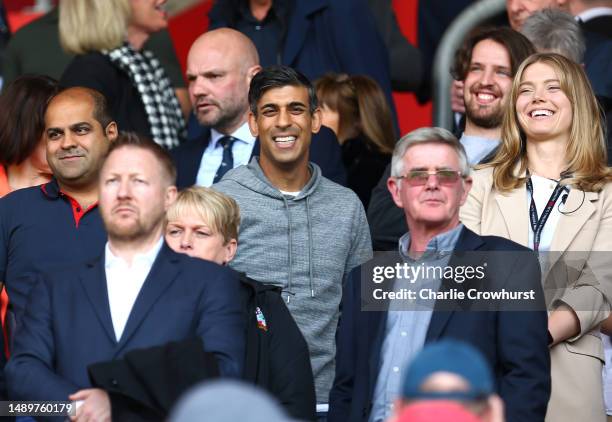 Rishi Sunak, Prime Minister of the United Kingdom, looks on as they enjoy the pre-match atmosphere prior to the Premier League match between...