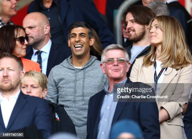 Rishi Sunak, Prime Minister of the United Kingdom, looks on as they enjoy the pre-match atmosphere prior to the Premier League match between...