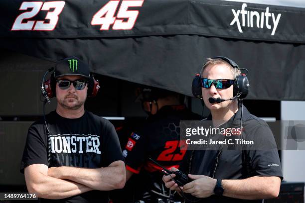 Retired NASCAR driver and advisor to 23XI Racing, Kurt Busch and interim crew chief, Dave Rogers of the Forward Together Toyota, look on during...