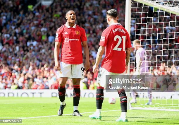Anthony Martial of Manchester United celebrates after scoring the team's first goal with teammates Antony during the Premier League match between...