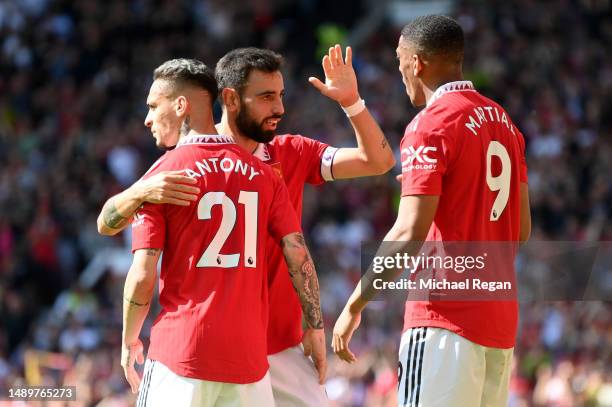 Anthony Martial of Manchester United celebrates after scoring the team's first goal with teammates Antony and Bruno Fernandes during the Premier...