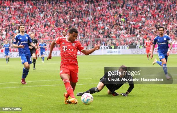 Serge Gnabry of FC Bayern Munich scores the team's fourth goal during the Bundesliga match between FC Bayern München and FC Schalke 04 at Allianz...
