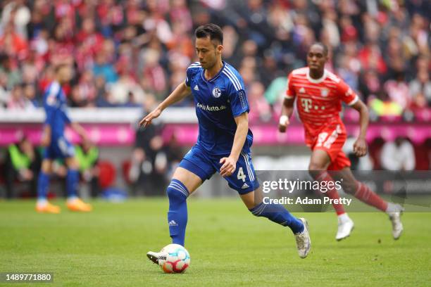 Maya Yoshida of FC Schalke 04 runs with the ball during the Bundesliga match between FC Bayern München and FC Schalke 04 at Allianz Arena on May 13,...