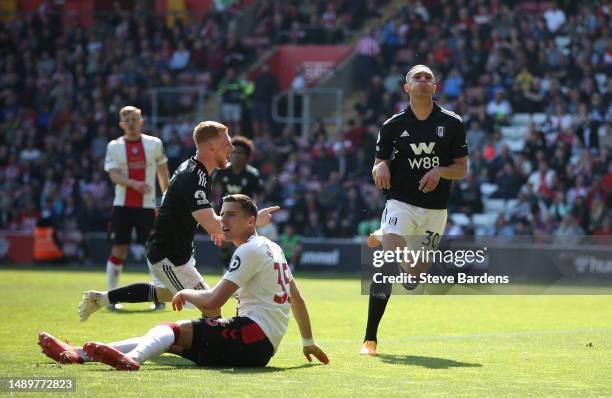 Carlos Vinicius of Fulham celebrates after scoring the team's first goal as Jan Bednarek of Southampton reacts during the Premier League match...