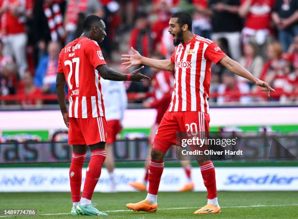 Sheraldo Becker of 1.FC Union Berlin celebrates with teammate Aissa Laidouni after scoring the team's fourth goal during the Bundesliga match between...