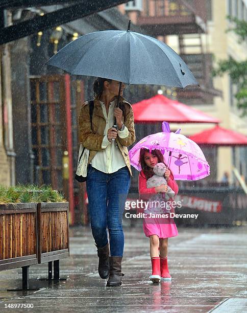 Katie Holmes and Suri Cruise seen walking in the rain in the Meat Packing District on July 20, 2012 in New York City.