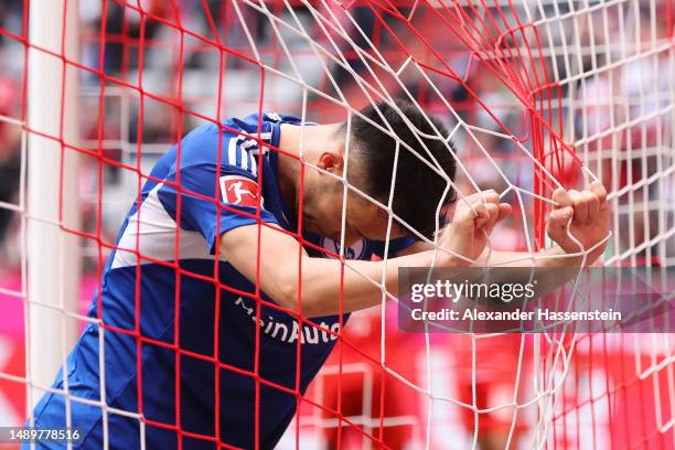 Maya Yoshida of FC Schalke 04 reacts after Noussair Mazraoui of FC Bayern Munich scores the team's sixth goal during the Bundesliga match between FC...