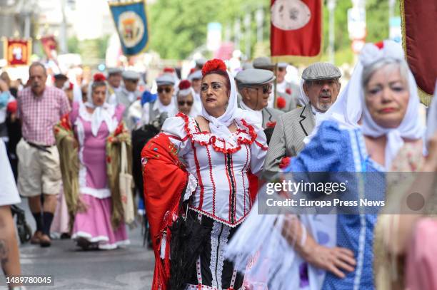 Several people dressed as chulapas and chulapos during the traditional parade from Sol to Las Vistillas during the San Isidro festivities on May 13,...