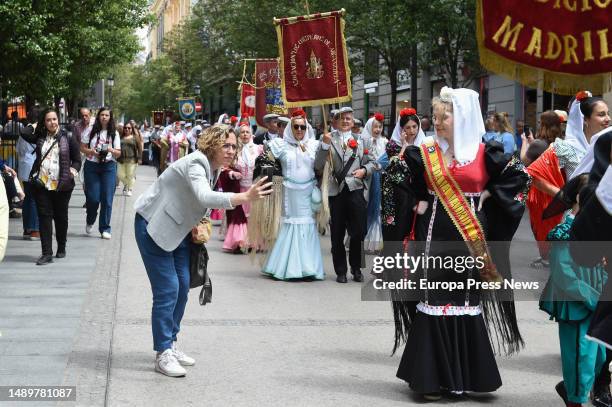 Several people dressed as chulapas and chulapos during the traditional parade from Sol to Las Vistillas during the San Isidro festivities on May 13,...