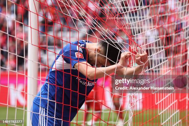 Maya Yoshida of FC Schalke 04 reacts after Noussair Mazraoui of FC Bayern Munich scores the team's sixth goal during the Bundesliga match between FC...