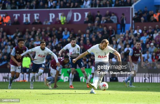 Harry Kane of Tottenham Hotspur scores the team's first goal from the penalty spot during the Premier League match between Aston Villa and Tottenham...