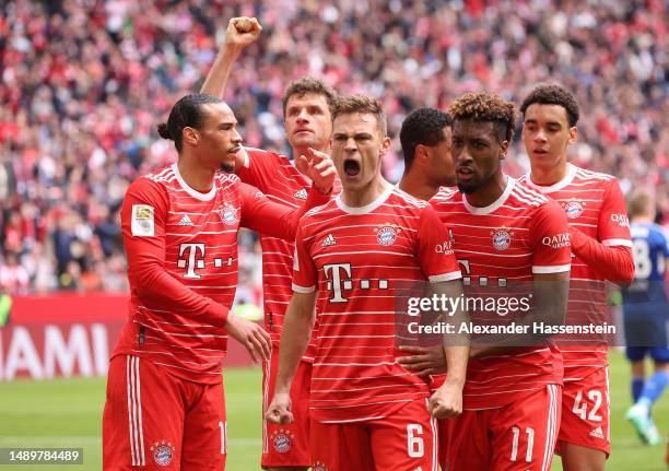 Joshua Kimmich of FC Bayern Munich celebrates with teammates after scoring the team's second goal during the Bundesliga match between FC Bayern...