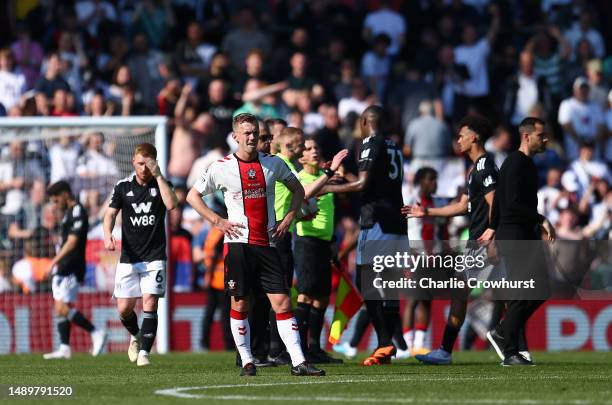 James Ward-Prowse of Southampton looks on as players of Southampton shakes hands with players of Northampton Saints after the Premier League match...