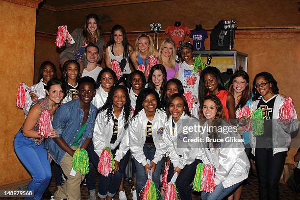Members of the 2012 UCA National High School Cheerleading Champions from Burlington Township High School pose backstage with the cast at the hit...