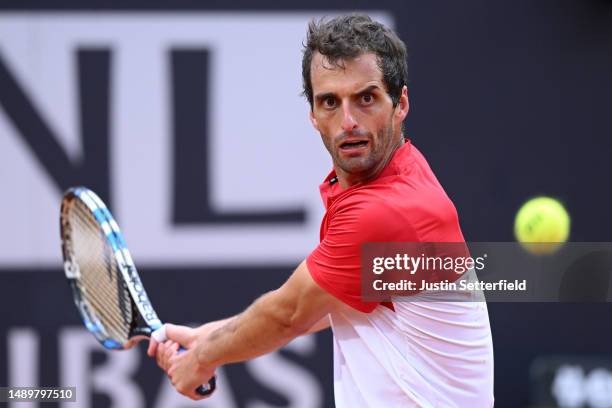 Albert Ramos-Vinolas of Spain plays a backhand during their singles second round match against Carlos Alcaraz of Spain during day six of the...