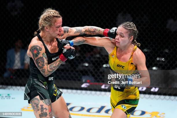 Jessica-Rose Clark of Australia punches Tainara Lisboa of Brazil in a bantamweight fight during the UFC Fight Night event at Spectrum Center on May...