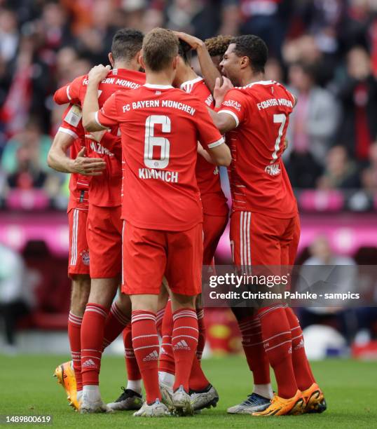 Thomas Mueller of FC Bayern Muenchen celebrates with teammates after scoring his team's first goal during the Bundesliga match between FC Bayern...