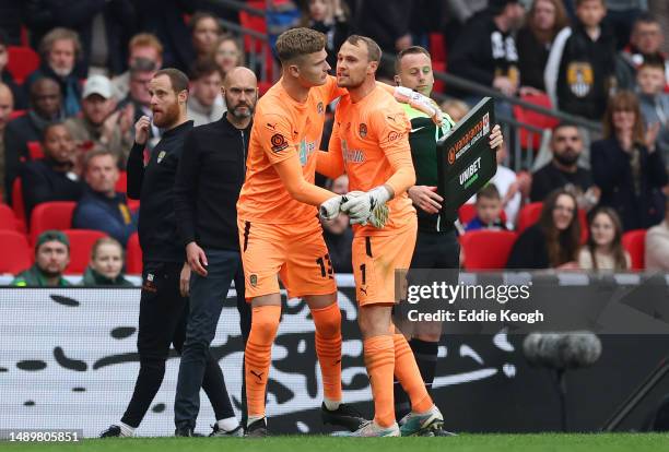 Archie Mair of Notts County embraces Sam Slocombe as they come on a substitute at the end of extra-time during the Vanarama National League Play-Off...