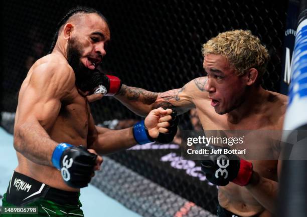 Bryan Battle knocks out Gabe Green with a punch in a welterweight fight during the UFC Fight Night event at Spectrum Center on May 13, 2023 in...