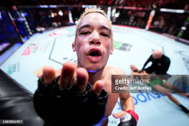 Bryan Battle reacts after his knockout victory over Gabe Green in a welterweight fight during the UFC Fight Night event at Spectrum Center on May 13,...
