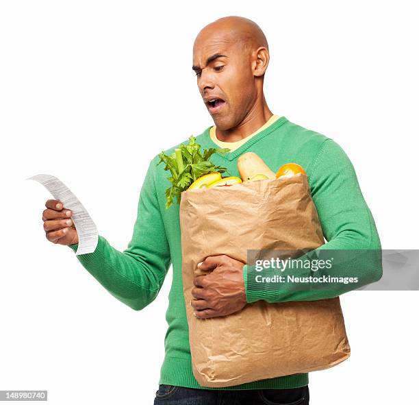junger mann, blick in die lebensmittel bill isoliert - schlechte nachricht stock-fotos und bilder