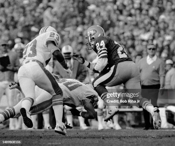 San Francisco RB Derrick Harmon on short run as Dolphins Joe Carter moves in during game action at Super Bowl XIX of Miami Dolphins vs. San Francisco...